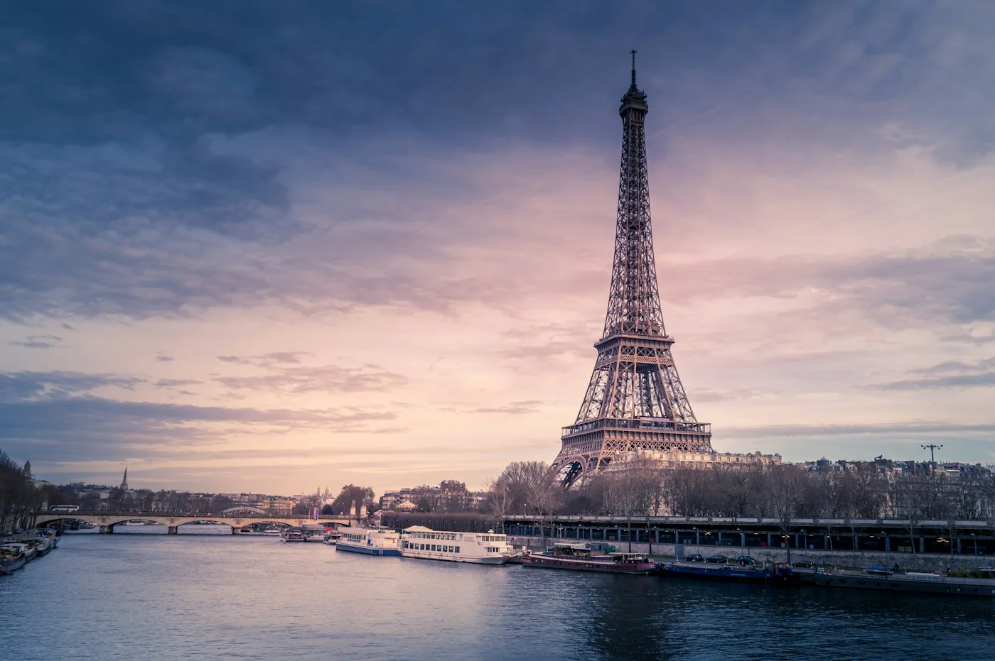 Eiffel Tower beside the Seine at dusk